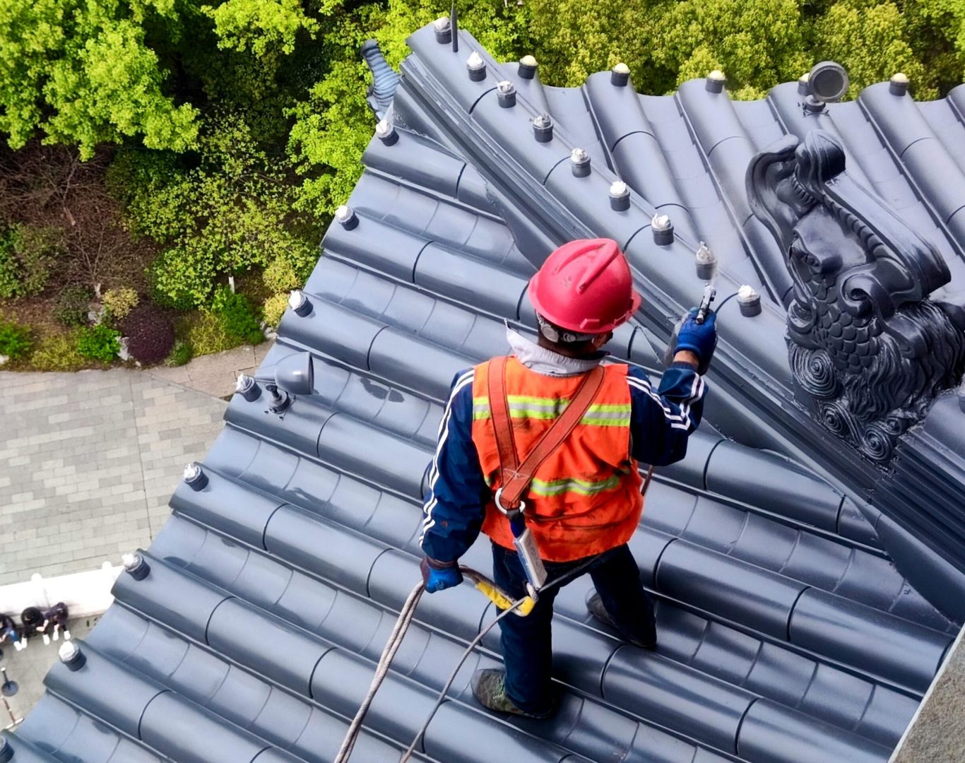 Professional roof cleaning in progress by Max's Real Estate Cleaning team in Los Angeles, CA, ensuring clean and debris-free roofs.